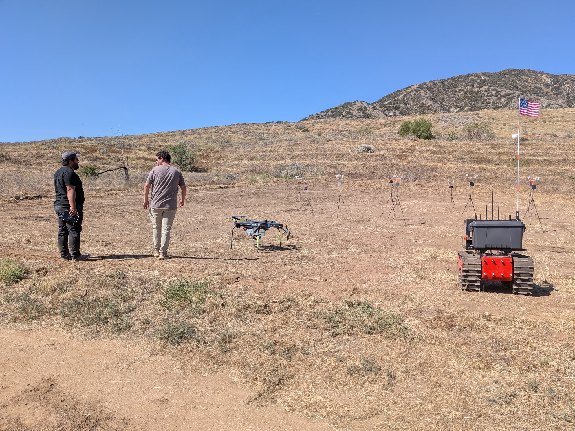 Tracked firefighting hardware prototype during an outdoor field demonstration